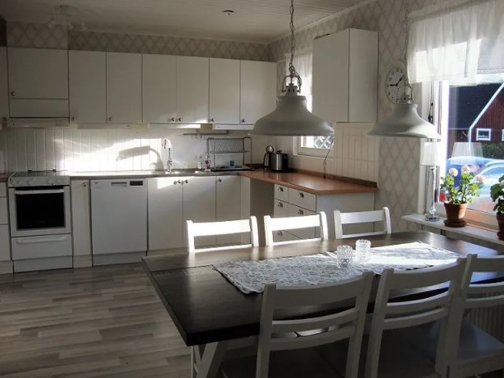 Large kitchen with a dining table and six chairs.