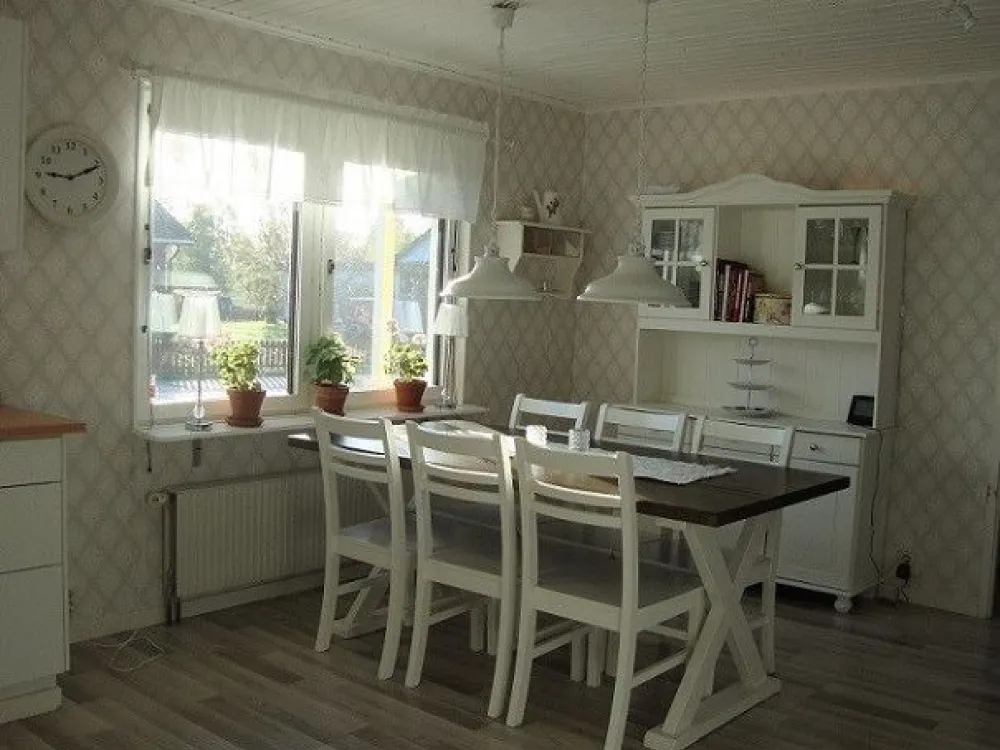 The dining table with six chairs.